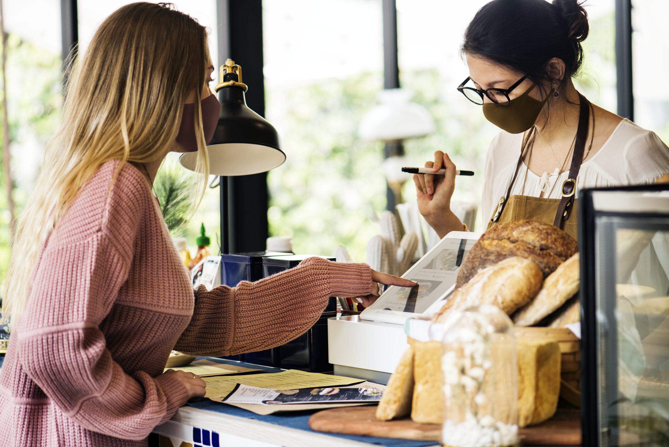 woman-wearing-mask-ordering-food-cafe-restaurant-covid-19